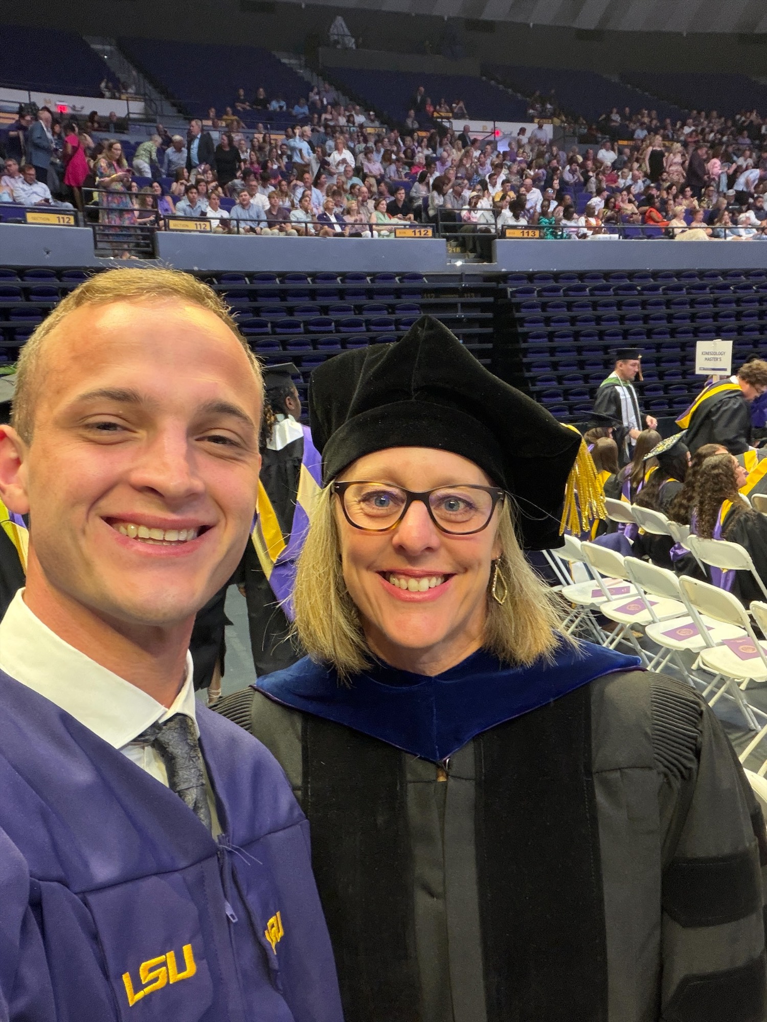 LSU graduate Joshua Smith poses with a faculty member during LSU commencement ceremonies. LSU graduate Joshua Smith poses with a faculty member during LSU commencement ceremonies.